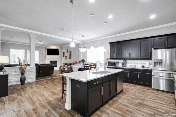 Dining room, Fireplace, Interior, Kitchen, Living room, Pendant Lights, Recessed Lighting, Stainless Steel Appliances, Wood Texture Flooring