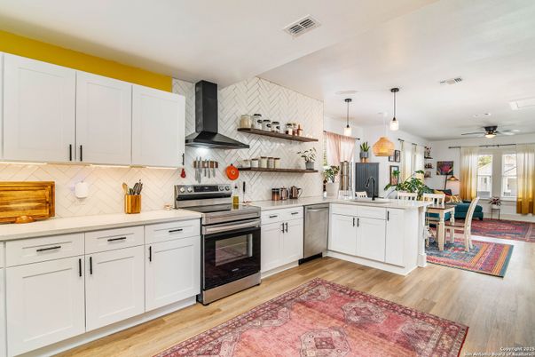 Dining room, Interior, Kitchen, Pendant Lights, Stainless Steel Appliances, Stone Walls, Wood Texture Flooring