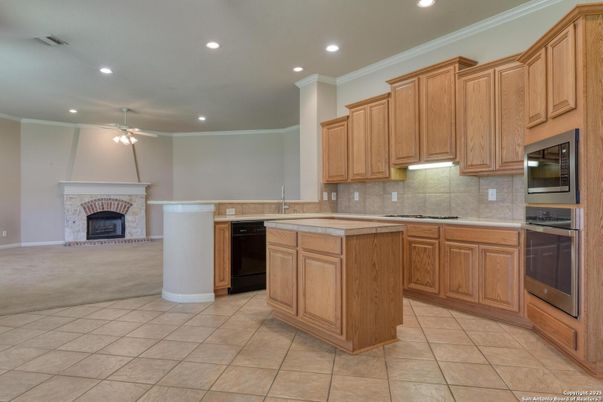 Fireplace, Interior, Kitchen, Recessed Lighting, Tile Countertops