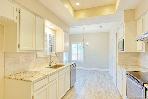Chandelier, Interior, Kitchen, Recessed Lighting, Stainless Steel Appliances, Wood Texture Flooring