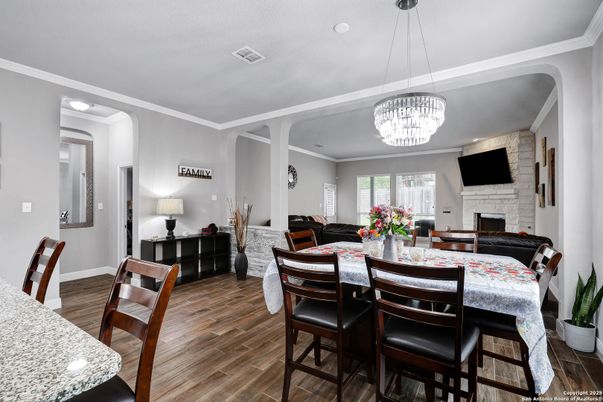 Chandelier, Dining room, Fireplace, Interior, Pendant Lights, Wood Texture Flooring