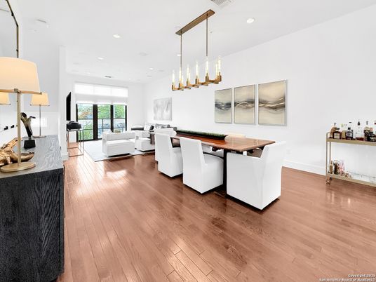 Dining room, Game Room, Interior, Living room, Pendant Lights, Recessed Lighting, Wood Texture Flooring