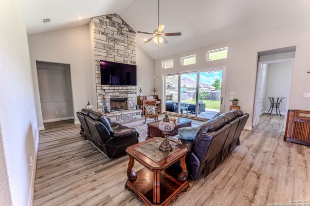 Fireplace, Interior, Living room, Recessed Lighting, Stone Walls, Wood Texture Flooring