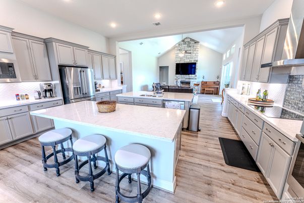 Fireplace, Interior, Kitchen, Recessed Lighting, Stainless Steel Appliances, Wood Texture Flooring