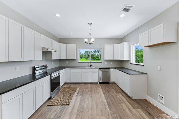 Chandelier, Interior, Kitchen, Pendant Lights, Recessed Lighting, Stainless Steel Appliances, Wood Texture Flooring