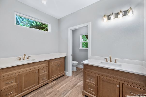 Bathroom, Dual Sink Vanities, Interior, Recessed Lighting, Wood Texture Flooring