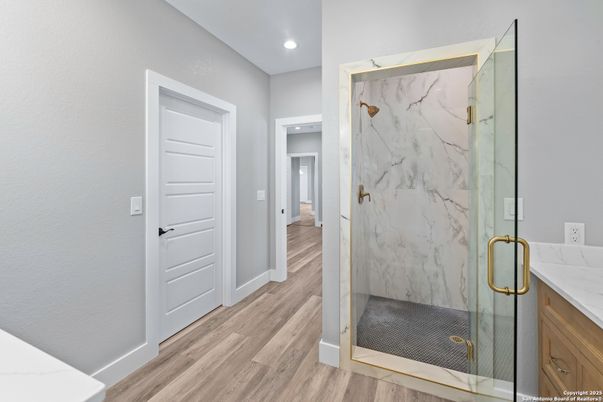 Bathroom, Glass Shower, Interior, Marble Walls, Recessed Lighting, Wood Texture Flooring