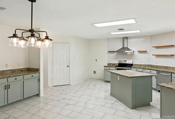 Interior, Kitchen, Marble, Pendant Lights, Stainless Steel Appliances, Stone Walls