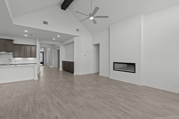 Empty room, Fireplace, Interior, Kitchen, Recessed Lighting, Wooden Beams, Wood Texture Flooring