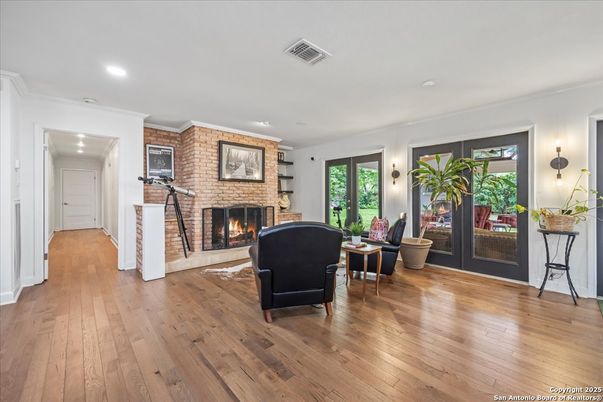 Fireplace, Interior, Living room, Recessed Lighting, Stone Walls, Wood Texture Flooring