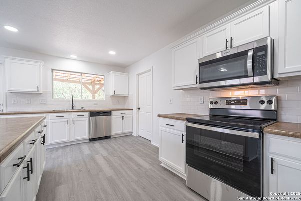 Interior, Kitchen, Recessed Lighting, Stainless Steel Appliances, Wood Texture Flooring