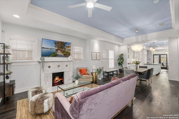 Chandelier, Dining room, Fireplace, Interior, Living room, Pendant Lights, Recessed Lighting, Wood Texture Flooring