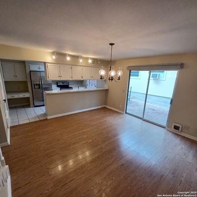 Chandelier, Empty room, Interior, Kitchen, Pendant Lights, Stainless Steel Appliances, Wood Texture Flooring