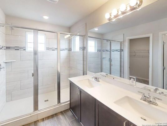 Bathroom, Dual Sink Vanities, Glass Shower, Interior, Recessed Lighting, Wood Texture Flooring