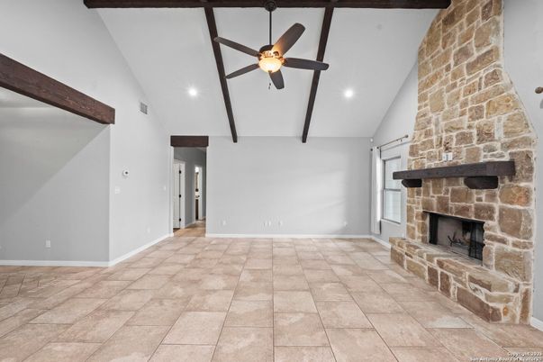 Empty room, Fireplace, Interior, Recessed Lighting, Stone Walls, Wooden Beams