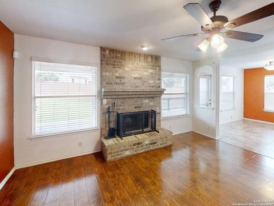 Empty room, Fireplace, Interior, Recessed Lighting, Stone Walls, Wood Texture Flooring