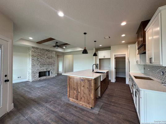 Fireplace, Interior, Kitchen, Pendant Lights, Recessed Lighting, Stone Walls, Wood Texture Flooring