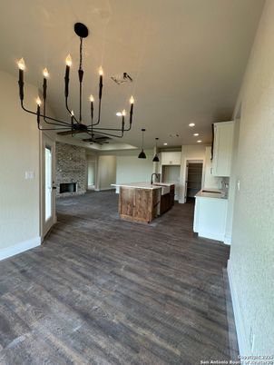 Chandelier, Empty room, Interior, Kitchen, Pendant Lights, Recessed Lighting, Stone Walls, Wood Texture Flooring