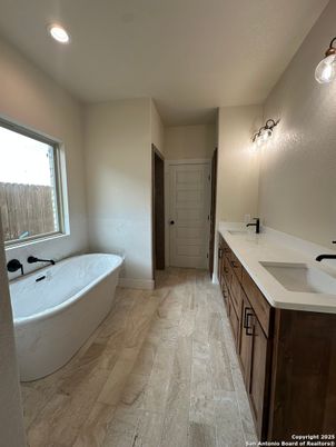 Bathroom, Dual Sink Vanities, Free Standing Baths, Interior, Recessed Lighting, Wood Texture Flooring