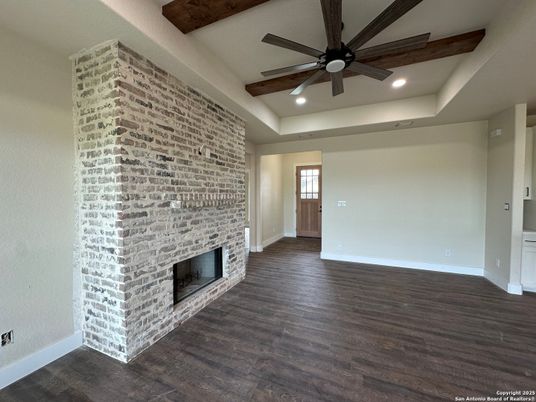 Empty room, Fireplace, Interior, Recessed Lighting, Stone Walls, Wooden Beams, Wood Texture Flooring