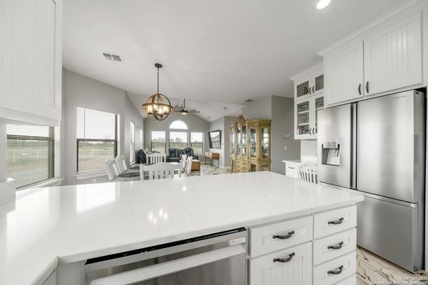 Chandelier, Dining room, Interior, Kitchen, Marble, Pendant Lights, Recessed Lighting, Stainless Steel Appliances