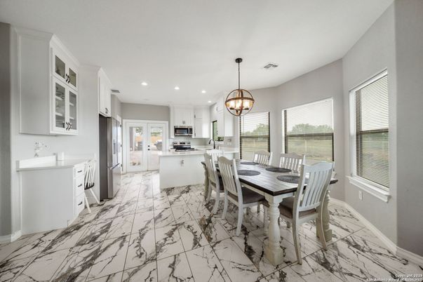 Chandelier, Dining room, Interior, Kitchen, Marble, Pendant Lights, Recessed Lighting, Stainless Steel Appliances