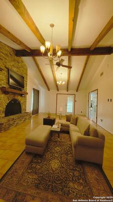 Chandelier, Fireplace, Interior, Living room, Stone Walls, Wooden Beams