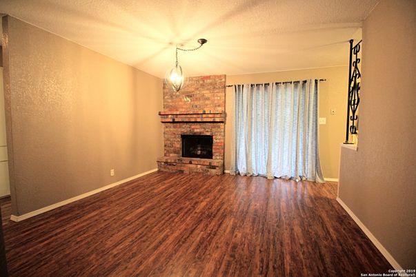 Empty room, Fireplace, Interior, Pendant Lights, Stone Walls, Wood Texture Flooring