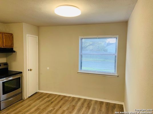 Empty room, Interior, Kitchen, Stainless Steel Appliances, Wood Texture Flooring
