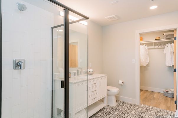 Bathroom, Glass Shower, Interior, Recessed Lighting, Walk-in Closets, Wood Texture Flooring