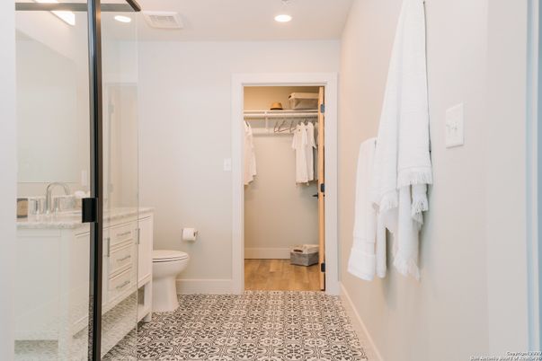 Bathroom, Glass Shower, Interior, Recessed Lighting, Walk-in Closets, Wood Texture Flooring