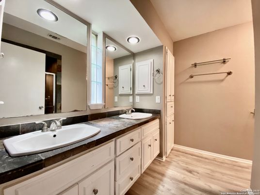 Bathroom, Dual Sink Vanities, Interior, Recessed Lighting, Wood Texture Flooring