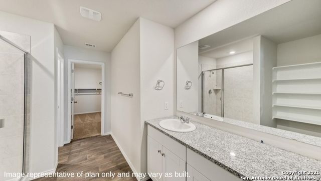 Bathroom, Dual Sink Vanities, Glass Shower, Interior, Recessed Lighting, Wood Texture Flooring