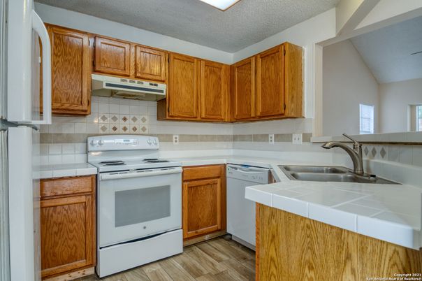 Interior, Kitchen, Tile Countertops, Wood Texture Flooring