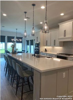 Chandelier, Dining room, Interior, Kitchen, Pendant Lights, Recessed Lighting, Stainless Steel Appliances, Wood Texture Flooring