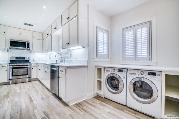 Interior, Recessed Lighting, Stainless Steel Appliances, Washer, Wood Texture Flooring
