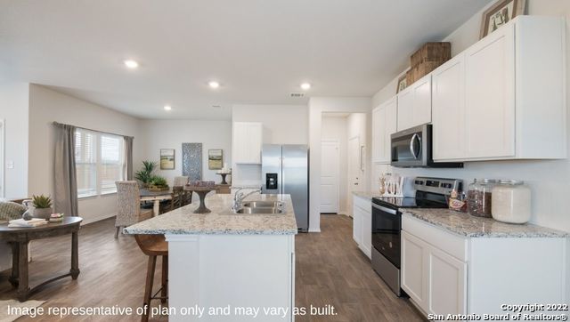 Dining room, Interior, Kitchen, Recessed Lighting, Stainless Steel Appliances, Wood Texture Flooring