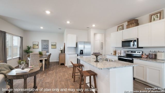 Dining room, Interior, Kitchen, Recessed Lighting, Stainless Steel Appliances, Wood Texture Flooring