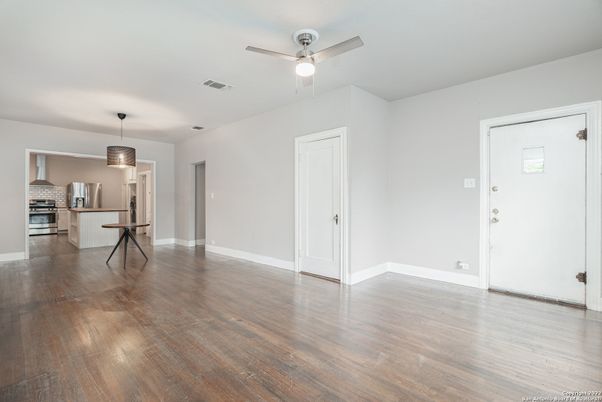 Empty room, Interior, Kitchen, Pendant Lights, Stainless Steel Appliances, Wood Texture Flooring