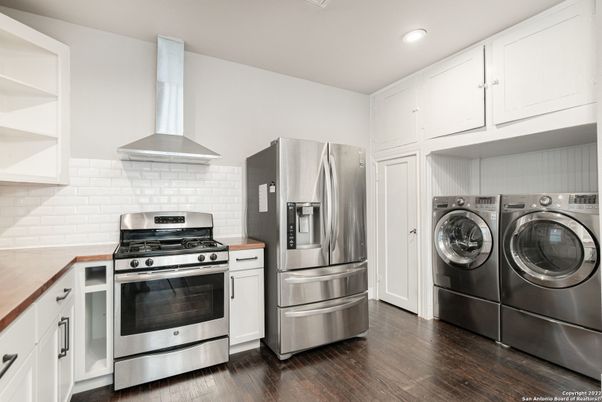 Interior, Kitchen, Recessed Lighting, Stainless Steel Appliances, Washer, Wood Texture Flooring