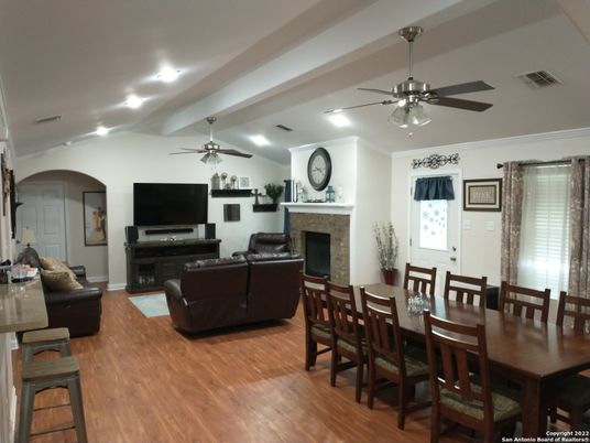 Dining room, Fireplace, Interior, Living room, Recessed Lighting, Wood Texture Flooring