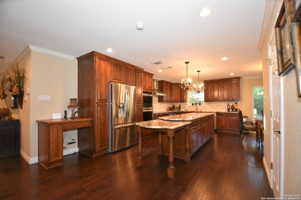 Chandelier, Dining room, Interior, Kitchen, Recessed Lighting, Stainless Steel Appliances, Wood Texture Flooring