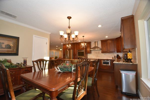 Chandelier, Dining room, Interior, Kitchen, Recessed Lighting, Stainless Steel Appliances, Wood Texture Flooring