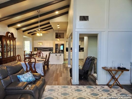 Dining room, Interior, Kitchen, Living room, Pendant Lights, Recessed Lighting, Stainless Steel Appliances, Wooden Beams, Wood Texture Flooring