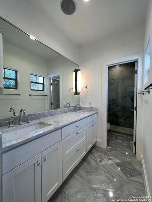 Bathroom, Dual Sink Vanities, Glass Shower, Interior, Marble, Recessed Lighting