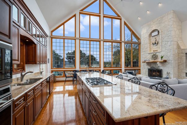 Fireplace, Interior, Kitchen, Living room, Recessed Lighting, Stone Walls, Wood Texture Flooring