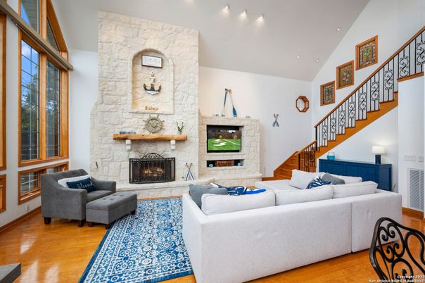 Fireplace, Interior, Living room, Recessed Lighting, Stone Walls, Wood Texture Flooring