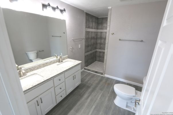 Bathroom, Dual Sink Vanities, Glass Shower, Interior, Wood Texture Flooring