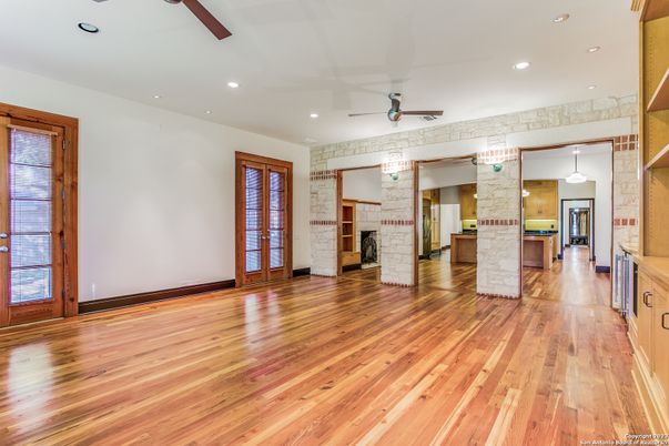 Empty room, Fireplace, Interior, Kitchen, Pendant Lights, Recessed Lighting, Stone Walls, Wood Texture Flooring