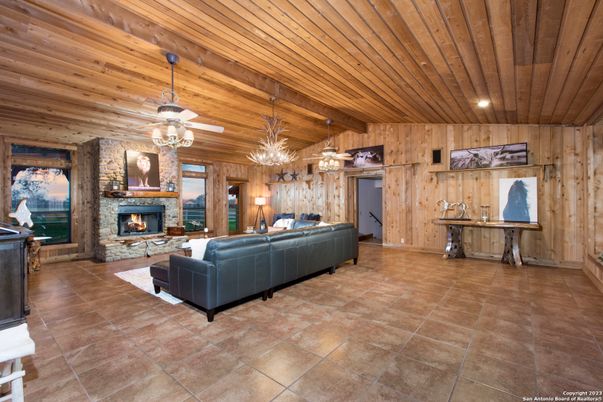 Chandelier, Fireplace, Interior, Living room, Recessed Lighting, Wooden Ceilings, Wooden Walls